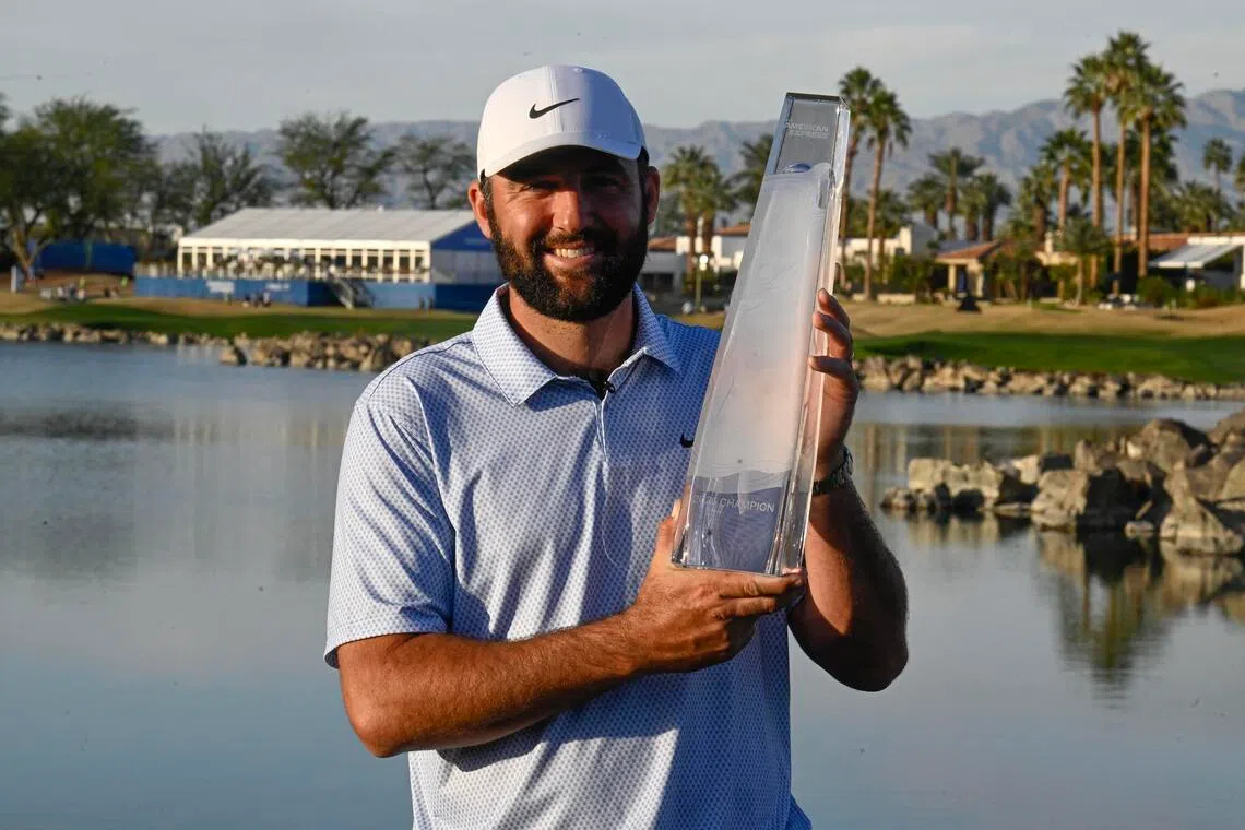 Scottie Scheffler holds the trophy after winning the final round of The American Express 2026 tournament at Pete Dye Stadium Course. 