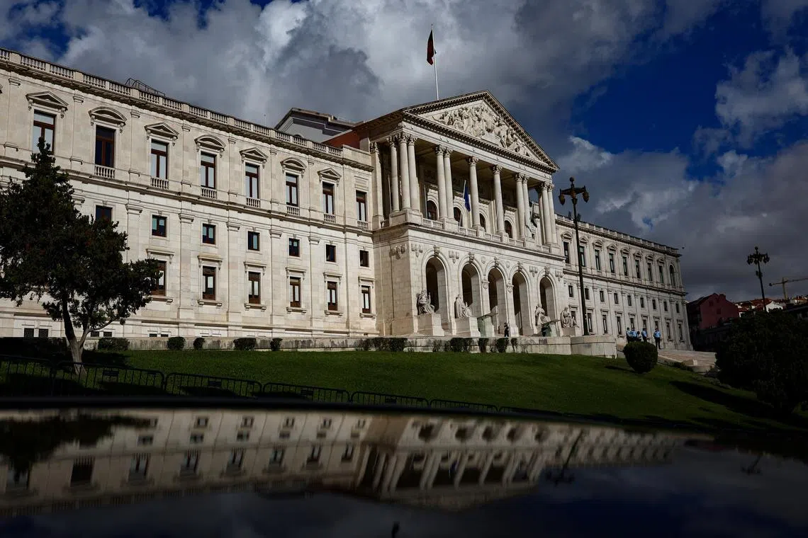 FILE PHOTO: A view of the Portuguese parliament and its reflection on the day Portugal's Finance Minister Joaquim Miranda Sarmento is expected to submit the 2025 budget draft to parliament, in Lisbon, Portugal, October 10, 2024. REUTERS/Pedro Nunes/File Photo