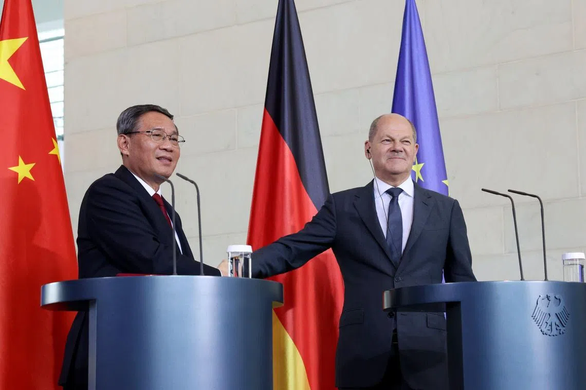 German Chancellor Olaf Scholz (right) and Chinese Premier Li Qiang at a joint news conference in Berlin, on June 20.