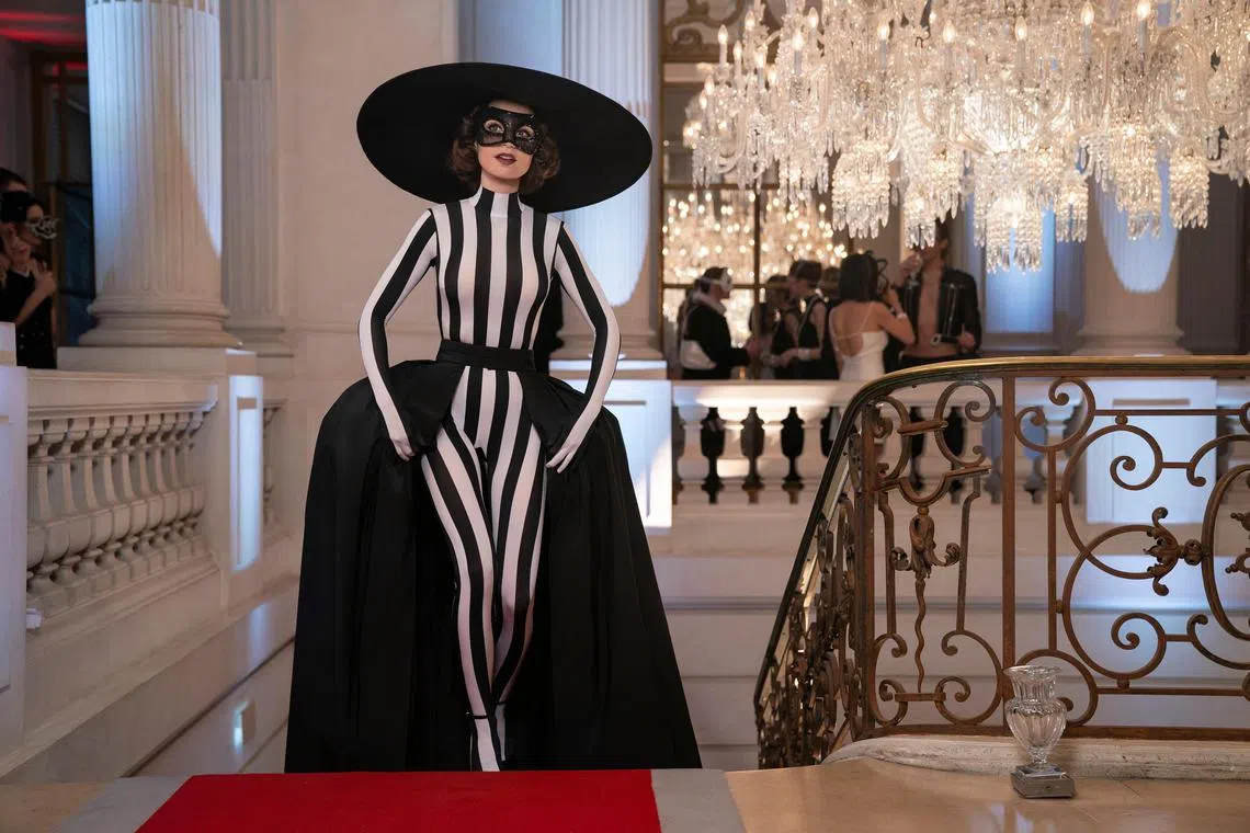 nytemily16 - Emily (Lily Collins) wears a black and white look to a masquerade ball this season of Emily In Paris that makes her appear a little like a sexy Hamburglar.

source/copyright: Netflix
free for publicity use
upload into Life folder