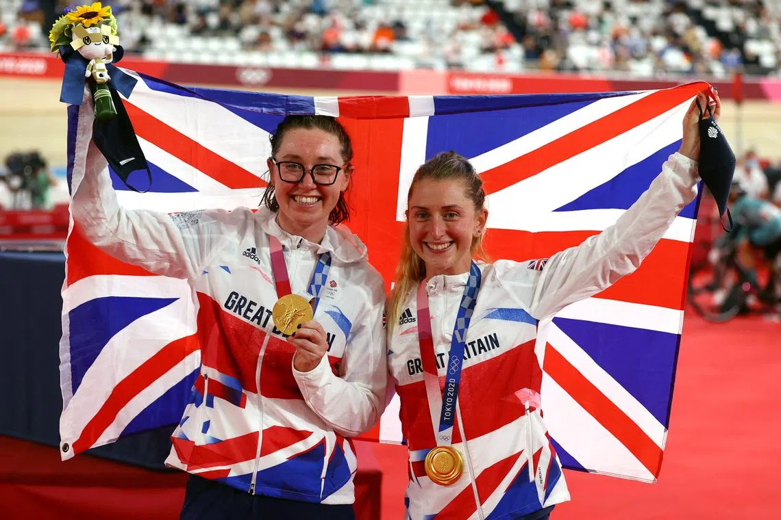 FILE PHOTO: Tokyo 2020 Olympics - Cycling - Track - Women's Madison - Medal Ceremony - Izu Velodrome, Shizuoka, Japan - August 6, 2021.  Gold medallists Laura Kenny of Britain and Katie Archibald of Britain celebrate on the podium. REUTERS/Matthew Childs/File Photo