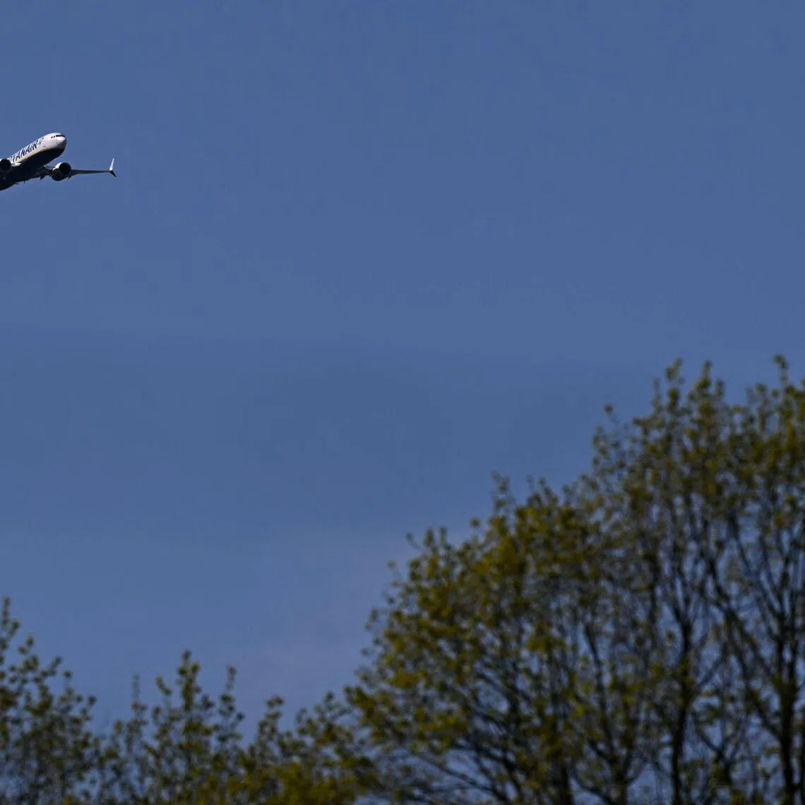 A Boeing 737 MAX 8-200 passenger aircraft operated by Ryanair prepares to land at Liverpool John Lennon Airport in Liverpool, north west England on April 22, 2026. The EU unveiled on April 22 plans to address the energy crisis triggered by the war in the Middle East, including improved monitoring of jet fuel supplies as the prospect of shortages rattles Europe ahead of the summer travel season. (Photo by Paul ELLIS / AFP)
