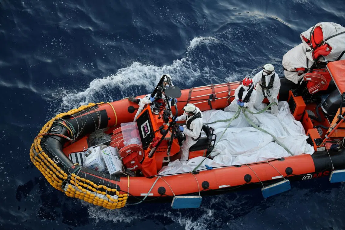 Handout image shows Medecins Sans Frontieres (MSF) teams retriving dead bodies of migrants in body bags from the Mediterranean sea June 7, 2024. MSF/Frederic Seguin/Handout via REUTERS