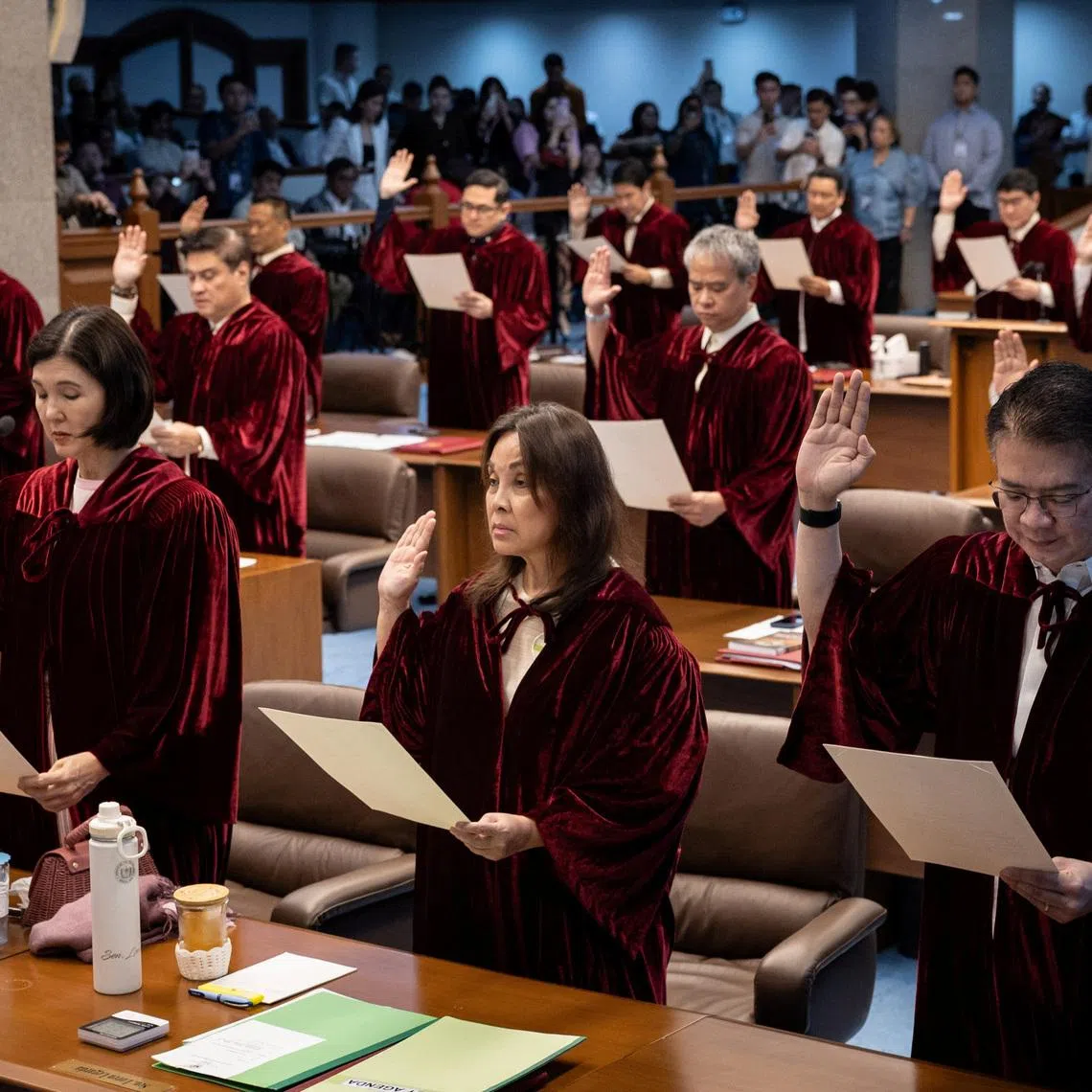 Philippine senators take oath as they convene as an impeachment court to hear the case of Vice President Sara Duterte, at the Senate in Pasay City, Philippines, May 18, 2026. REUTERS/Eloisa Lopez