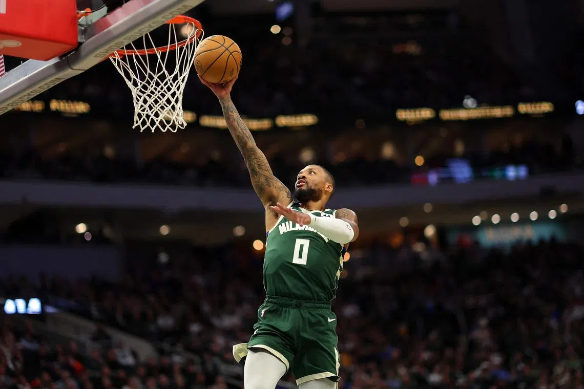 Damian Lillard of the Milwaukee Bucks driving to the basket during the first half of a game against the Portland Trail Blazers at Fiserv Forum.