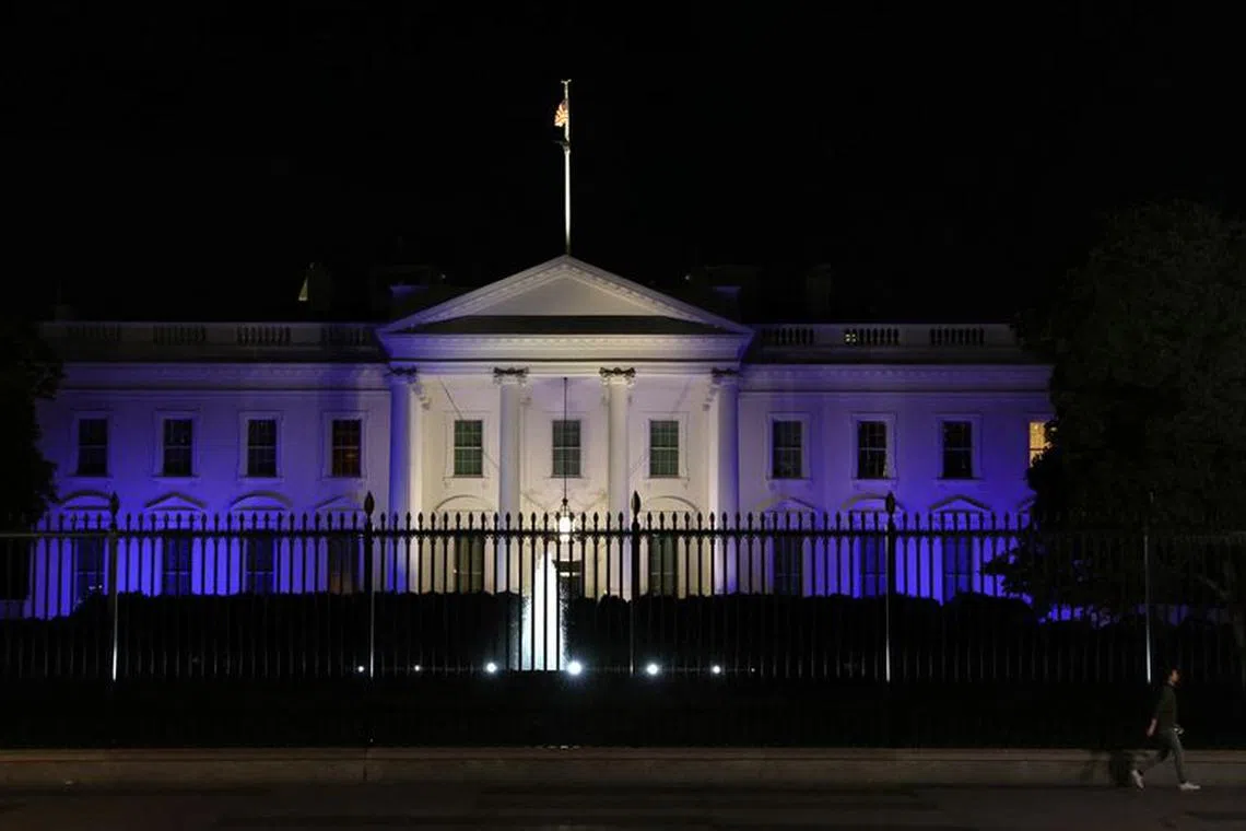 The White House is lit with the colors of the Israeli flag in Washington, U.S., October 9, 2023. REUTERS/Leah Millis