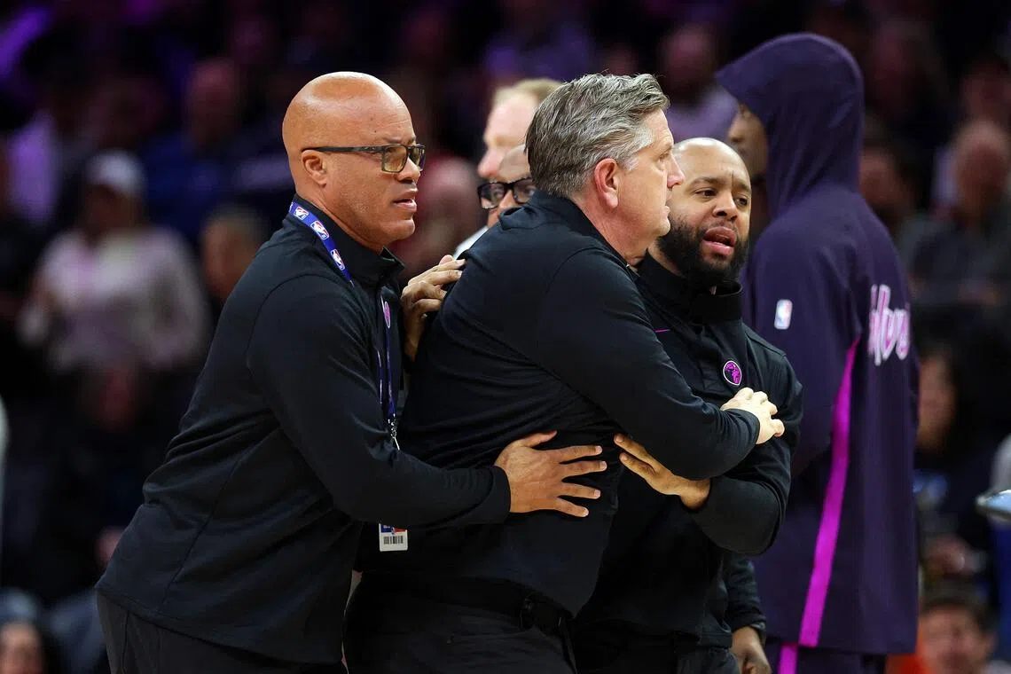 Timberwolves head coach Chris Finch is escorted off the floor, after being ejected in the first quarter of the game against the Oklahoma City Thunder on Dec 19.