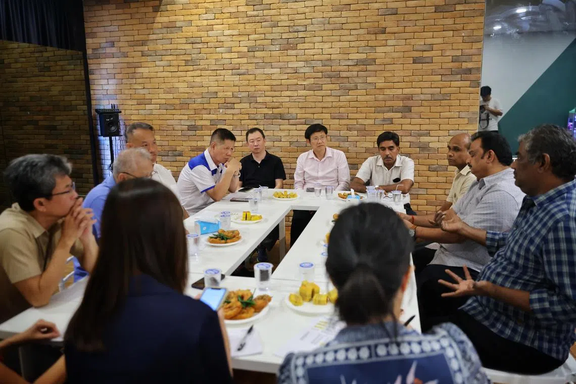 Representatives of two newspaper associations attending a dialogue session with Ang Mo Kio GRC MP Gan Thiam Poh (centre), who is an adviser to one of the groups, on Oct 30.