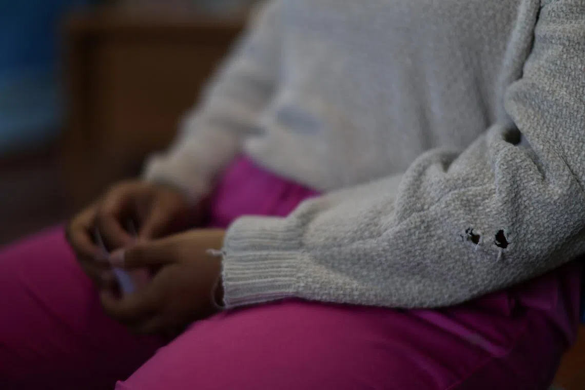 A former cartel member, who requested to be identified as Isabel, speaks during an interview with Reuters at an undisclosed location in Mexico April 3, 2025. REUTERS/Raquel Cunha