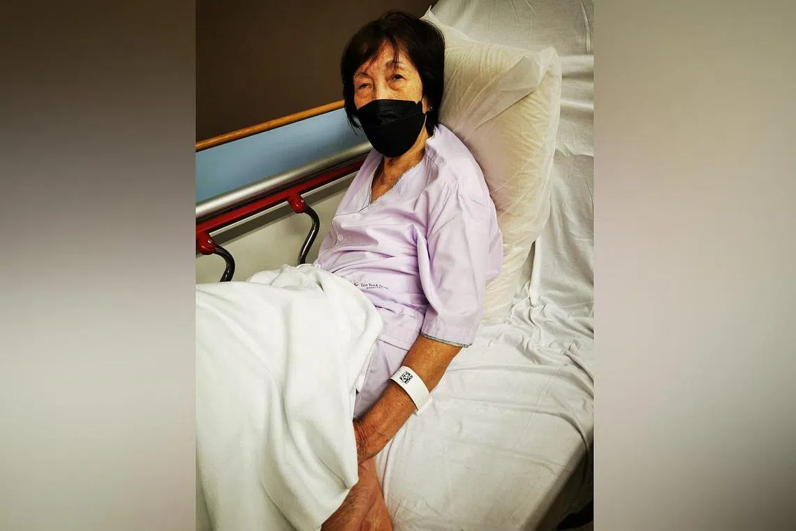 Madam Lim had been about to alight from the SBS Transit bus when the doors suddenly closed and hit her on the shoulder, causing her to fall.