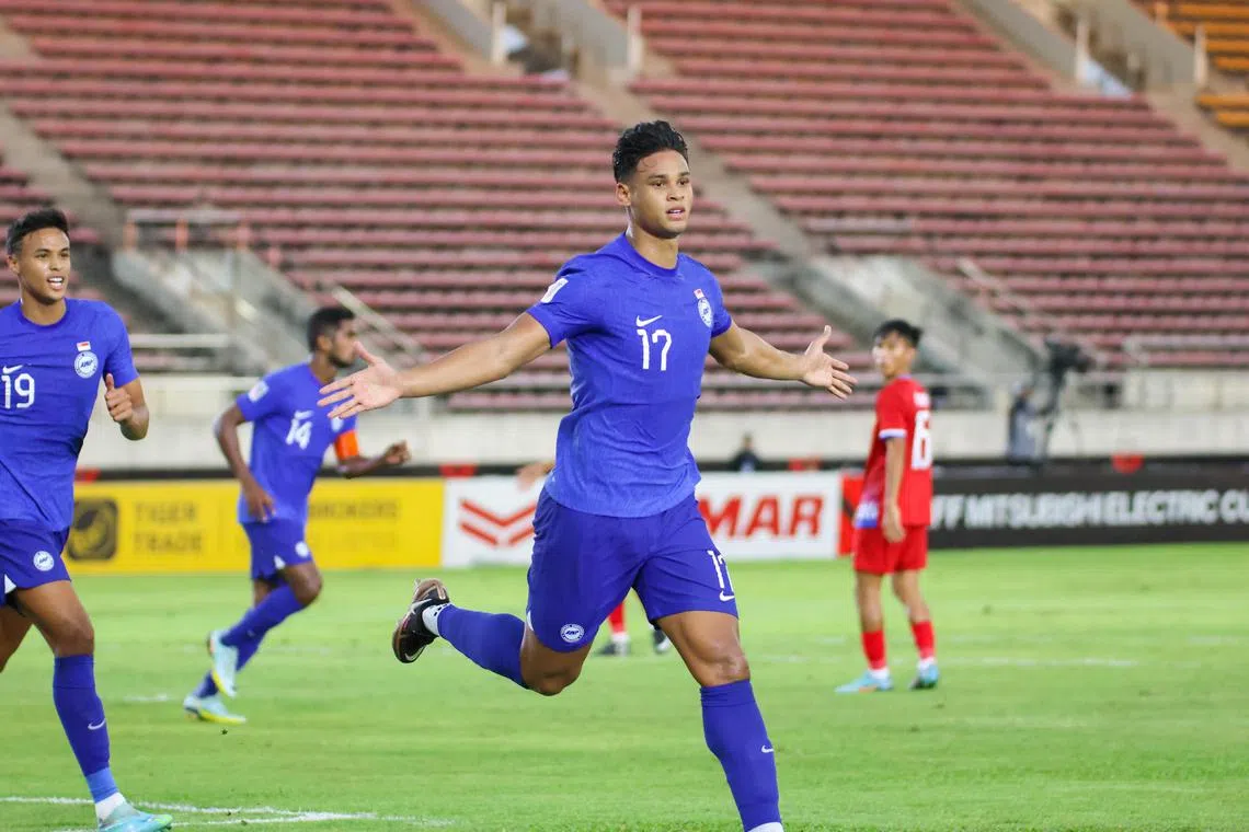 Irfan Fandi celebrates after giving Singapore the lead against Laos in an AFF Championship Group B match.