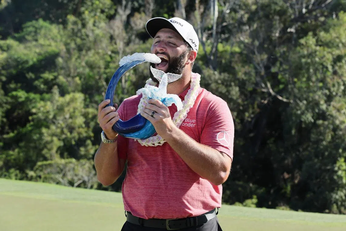 LAHAINA, HAWAII - JANUARY 08: Jon Rahm of Spain celebrates with the trophy after winning during the final round of the Sentry Tournament of Champions at Plantation Course at Kapalua Golf Club on January 08, 2023 in Lahaina, Hawaii.   Andy Lyons/Getty Images/AFP (Photo by ANDY LYONS / GETTY IMAGES NORTH AMERICA / Getty Images via AFP)