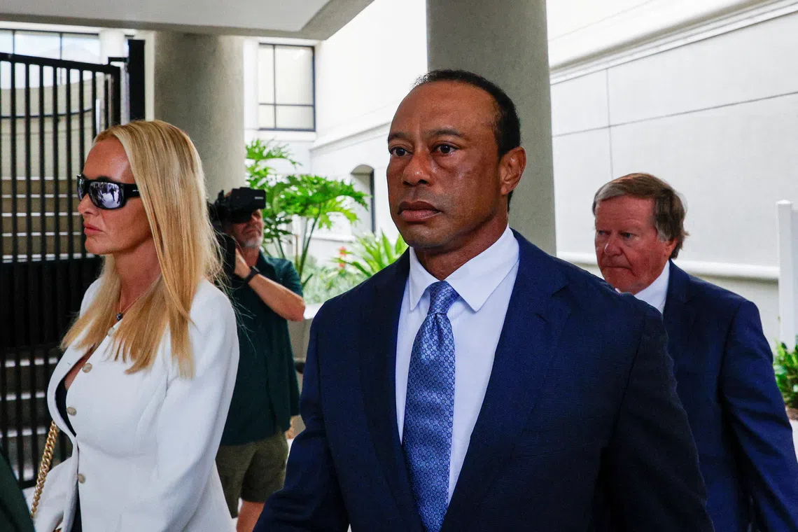 Golfer Tiger Woods flanked by his girlfriend, Vanessa Trump, leaves the courthouse after his scheduled appearance before a judge in person for the first time since his March 27 car accident, when he was arrested on a misdemeanor driving under the influence (DUI) charge after a rollover crash, in Stuart, Florida, U.S., September 2, 2026. REUTERS/Marco Bello