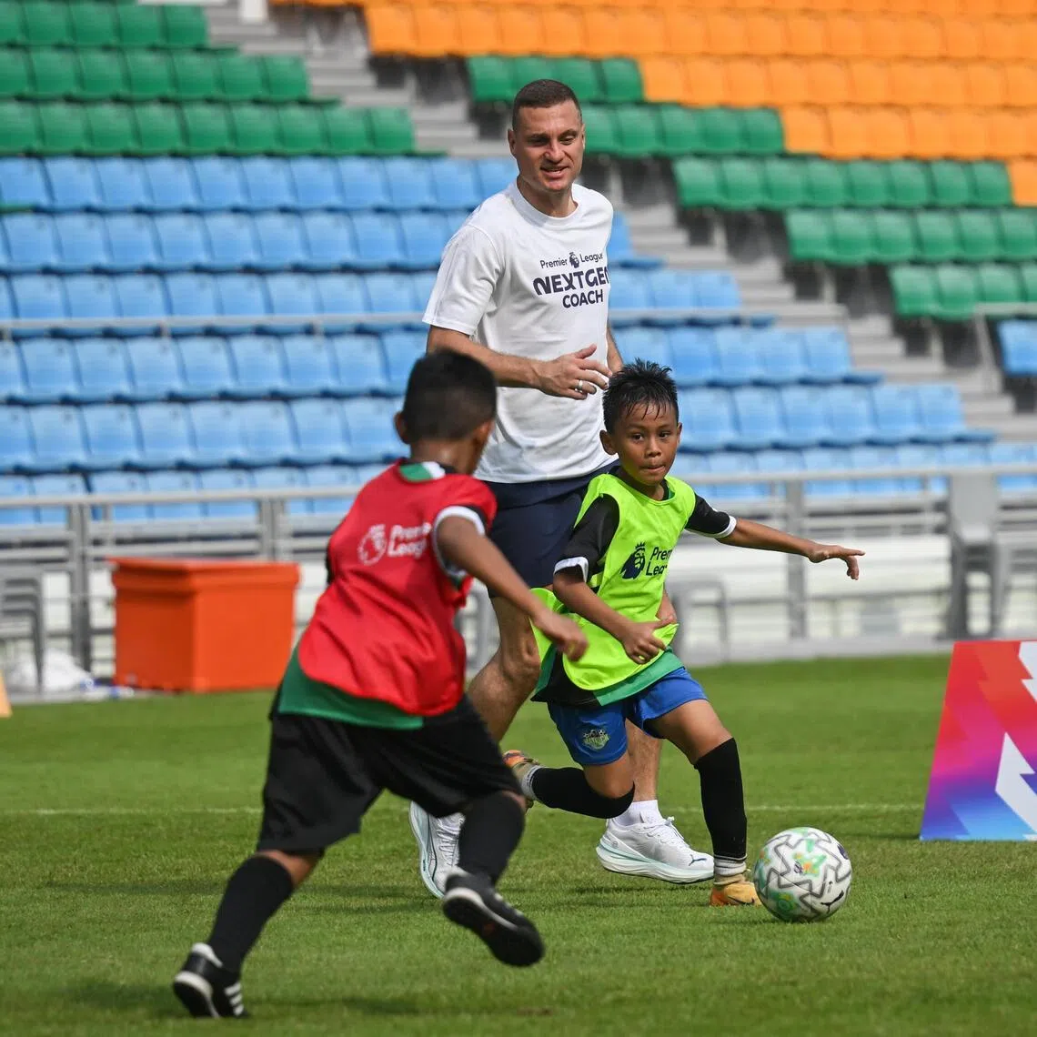 Former Inter Milan and Manchester United player Nemanja Vidic in a game with young players at the Premier League's NEXTGEN Coach Football Festival at the Jalan Besar Stadium on May 23, 2026.