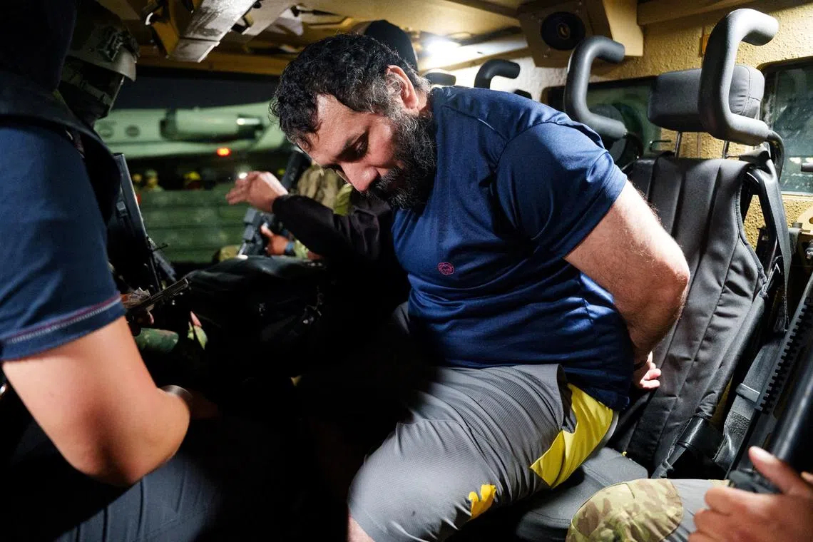 FILE PHOTO: Jose Adolfo Macias known as \"Fito\", the leader of the Los Choneros criminal group, sits in an armoured personnel carrier after he was recaptured following his escape from a Guayaquil prison in 2024, in Guayaquil, Ecuador, in this handout picture obtained by Reuters on June 26, 2025. Ecuadorean Armed Forces/Handout via REUTERS/File Photo