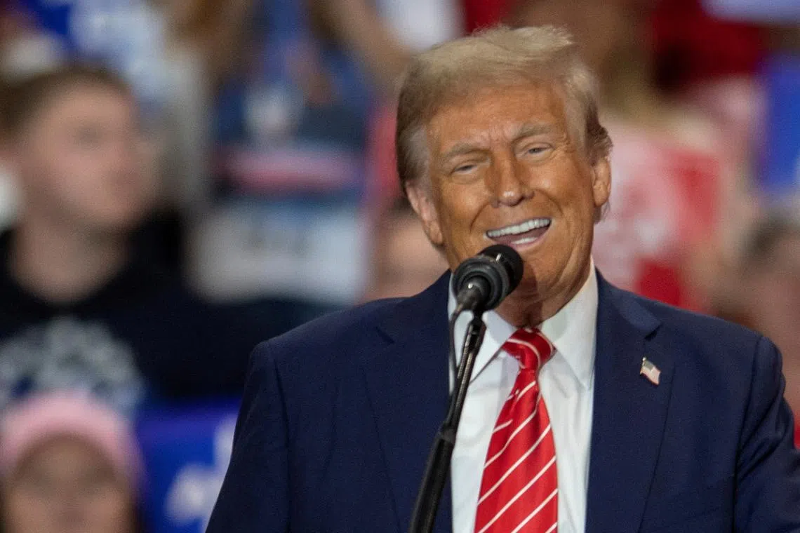 FILE PHOTO: Republican presidential nominee and former U.S. President Donald Trump speaks during a campaign rally at the Rocky Mount Event Center in Rocky Mount, North Carolina, October 30, 2024. REUTERS/Jay Paul/File Photo