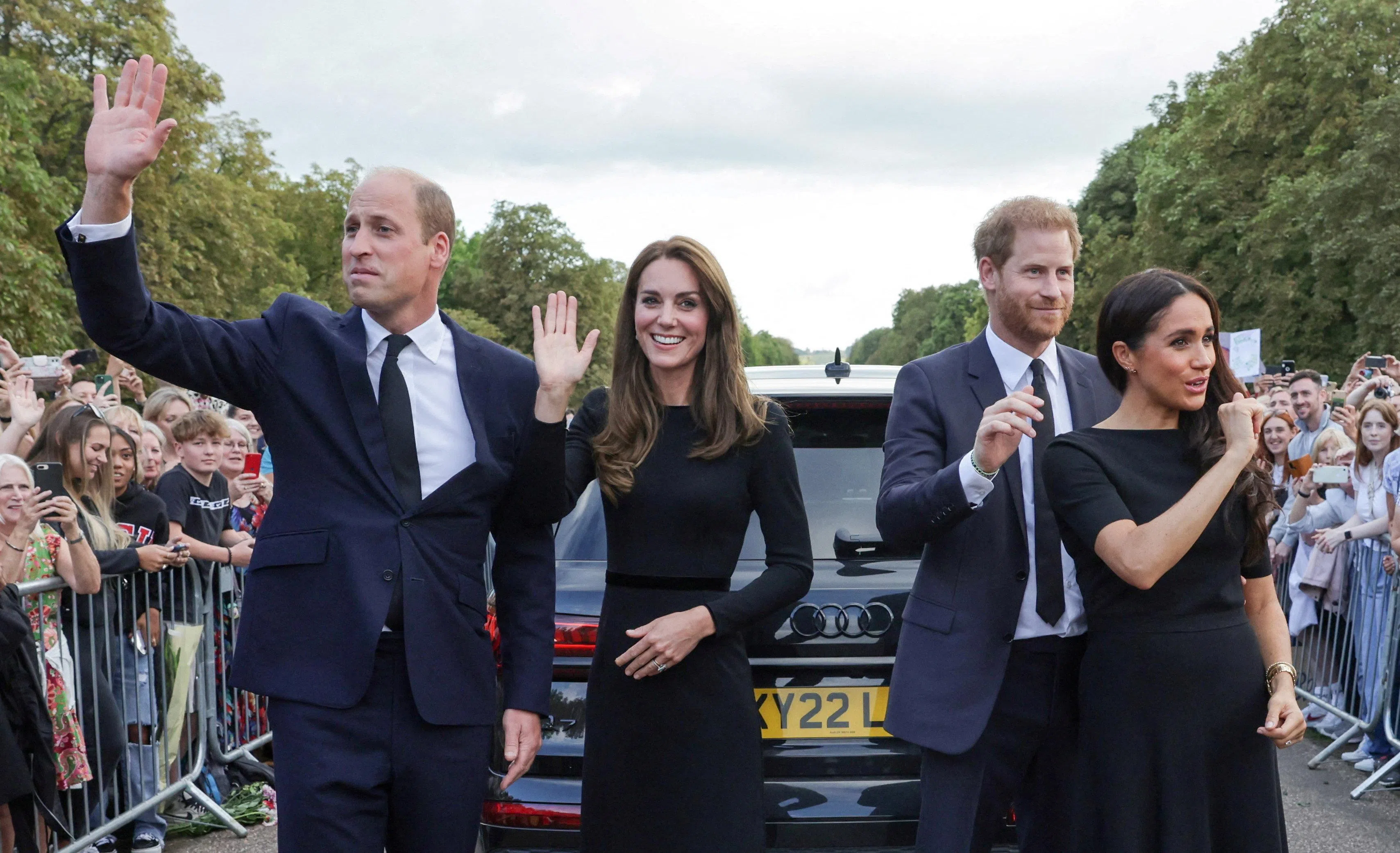 FILE PHOTO: Britain's William, Prince of Wales, Catherine, Princess of Wales, Britain's Prince Harry and Meghan, the Duchess of Sussex, wave to members of the public at Windsor Castle, following the passing of Britain's Queen Elizabeth, in Windsor, Britain, September 10, 2022. Chris Jackson/Pool via REUTERS/File Photo