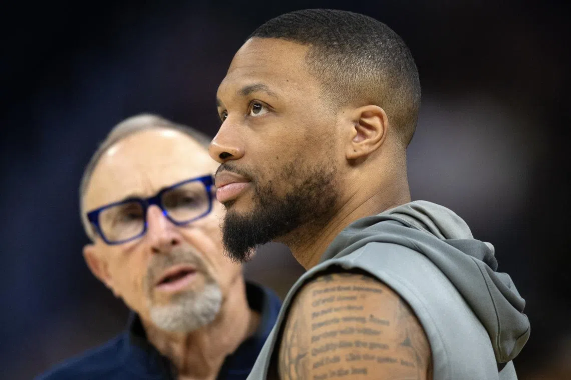 Mar 18, 2025; San Francisco, California, USA; Milwaukee Bucks guard Damian Lillard (right) chats up Golden State Warriors assistant coach Ron Adams before a game at Chase Center. Mandatory Credit: D. Ross Cameron-Imagn Images/File Photo