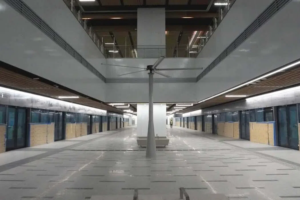 The station platforms incorporate sustainable features such as high-volume, low-speed fans for hybrid cooling.