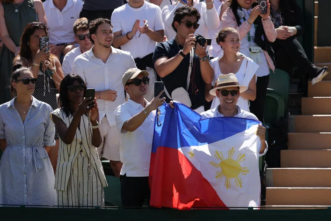 Fans in the stands with the flag of Philippines in support of Philippines’ Alexandra Eala during her second round match against Australia’s Maya Joint.
