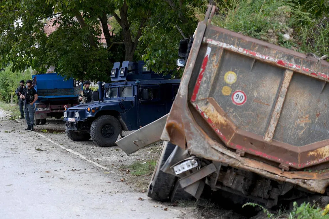 Kosovo police guarding an area around a monastery in northern Kosovo where deadly clashes erupted last week.