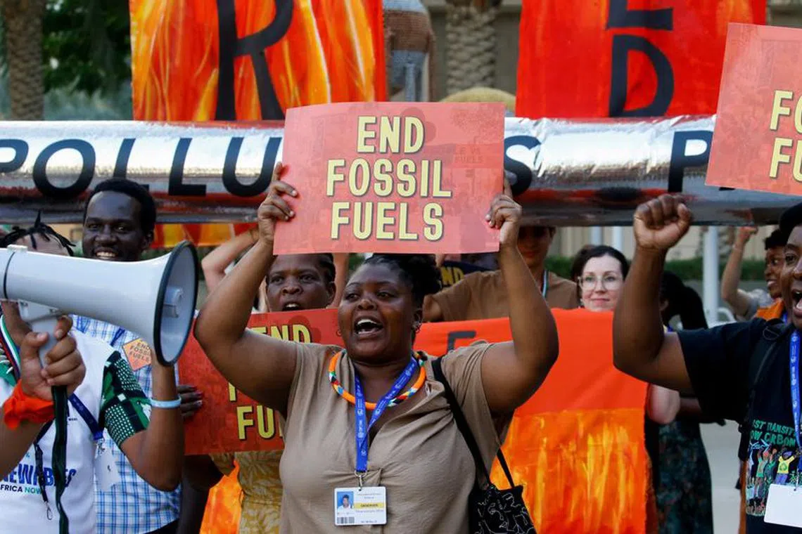 Activists participate in a demonstration against fossil fuels, during the United Nations Climate Change Conference COP28 in Dubai, United Arab Emirates, December 5, 2023. REUTERS/Thomas Mukoya/File Photo