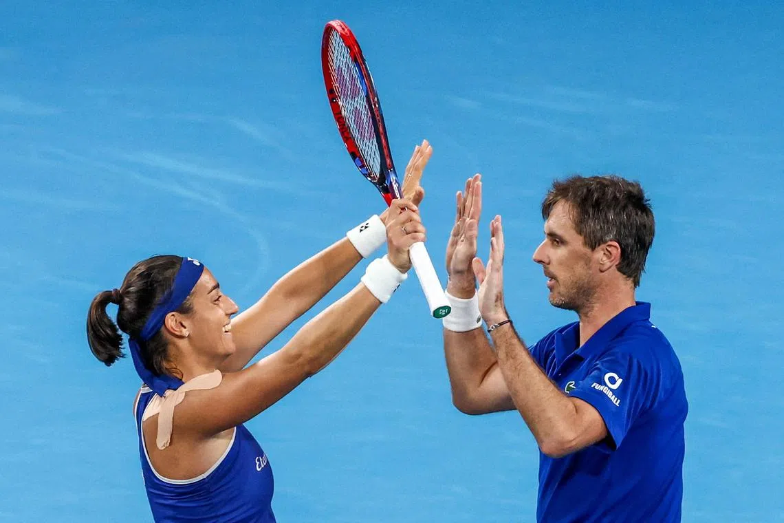 France's Caroline Garcia and Edouard Roger-Vasselin celebrate after defeating Norway's Casper Ruud and Ulrikke Eikeri to reach the semi-finals of the United Cup.