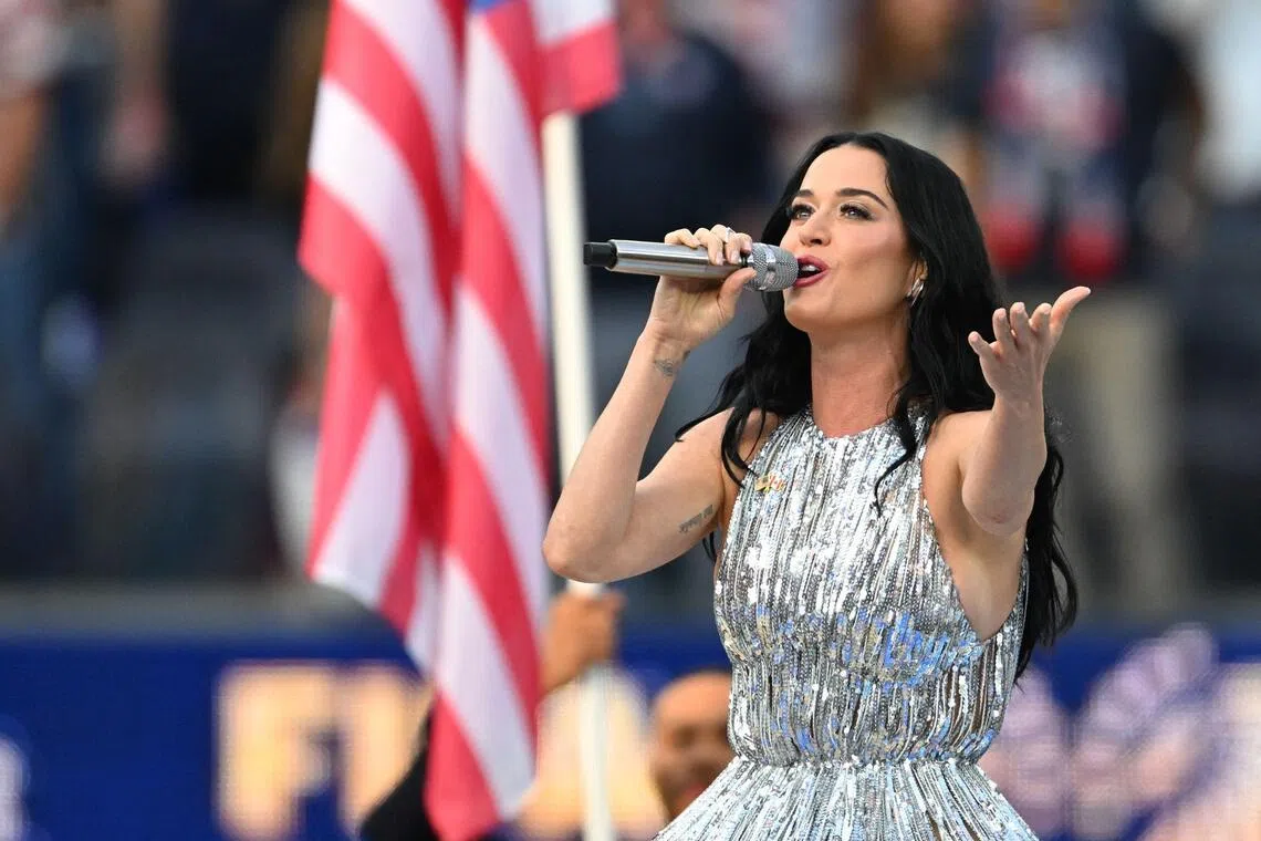Katy Perry sings the national anthem ahead of the 2026 World Cup Group D football match between USA and Paraguay at SoFi Stadium  on June 12, 2026. 