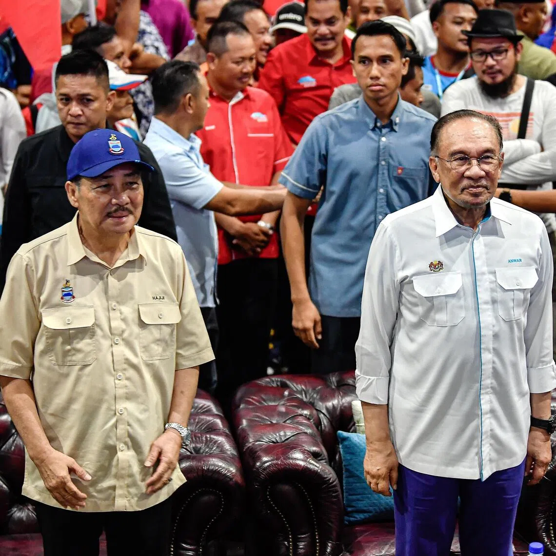 Malaysian Prime Minister Anwar Ibrahim's (right) Pakatan Harapan won just one seat at the Sabah polls, but will hope to count on Chief Minister Hajiji Noor's loyalty going forward.