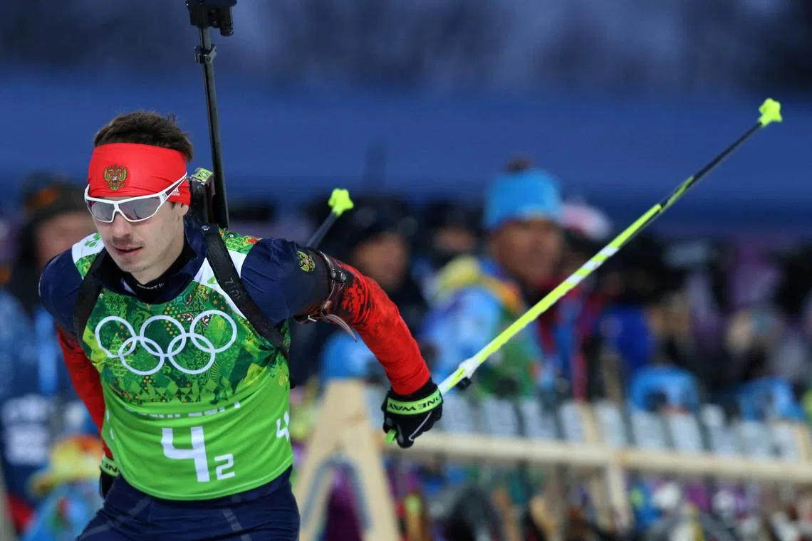 FILE PHOTO: Russia's Evgeny Ustyugov skis during the men's biathlon 4 x 7.5 km relay at the Sochi 2014 Winter Olympic Games February 22, 2014.     REUTERS/Sergei Karpukhin/ File Photo