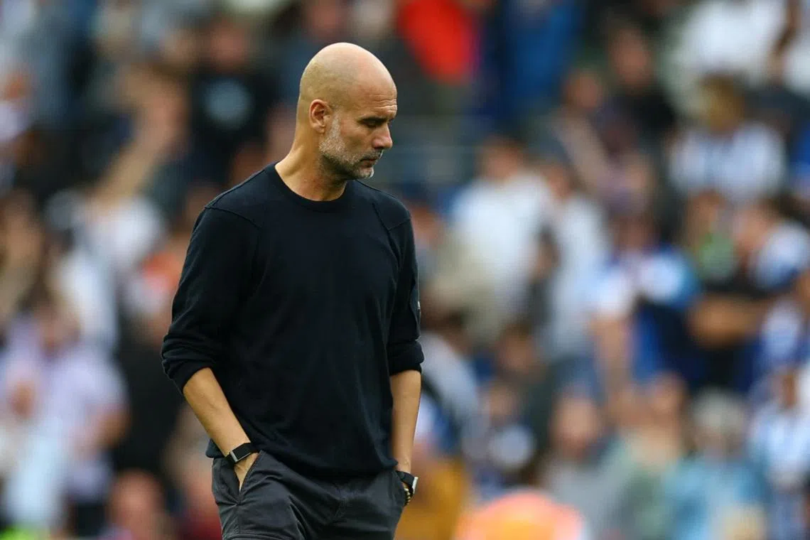 Manchester City manager Pep Guardiola looking dejected following the 2-1 defeat by Brighton & Hove Albion.