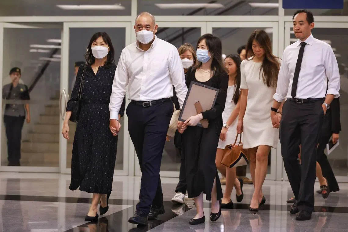 The late Sergeant (1) Edward H. Go’s (from left) mother Mrs Helen Go, father Mr Daniel Go and sister Rachel Go leaving after proceedings at Mandai.