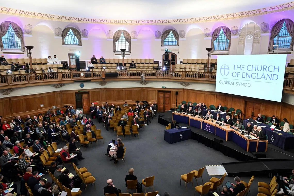 Members attend the Church of England Synod, at Church House, in London, on Wednesday. 