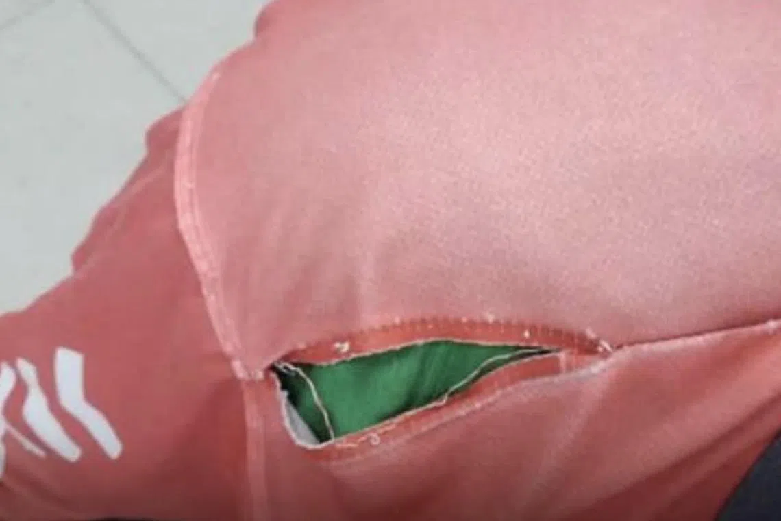 A torn uniform of a Pos Malaysia mailman, who had asked whether he could get a replacement.