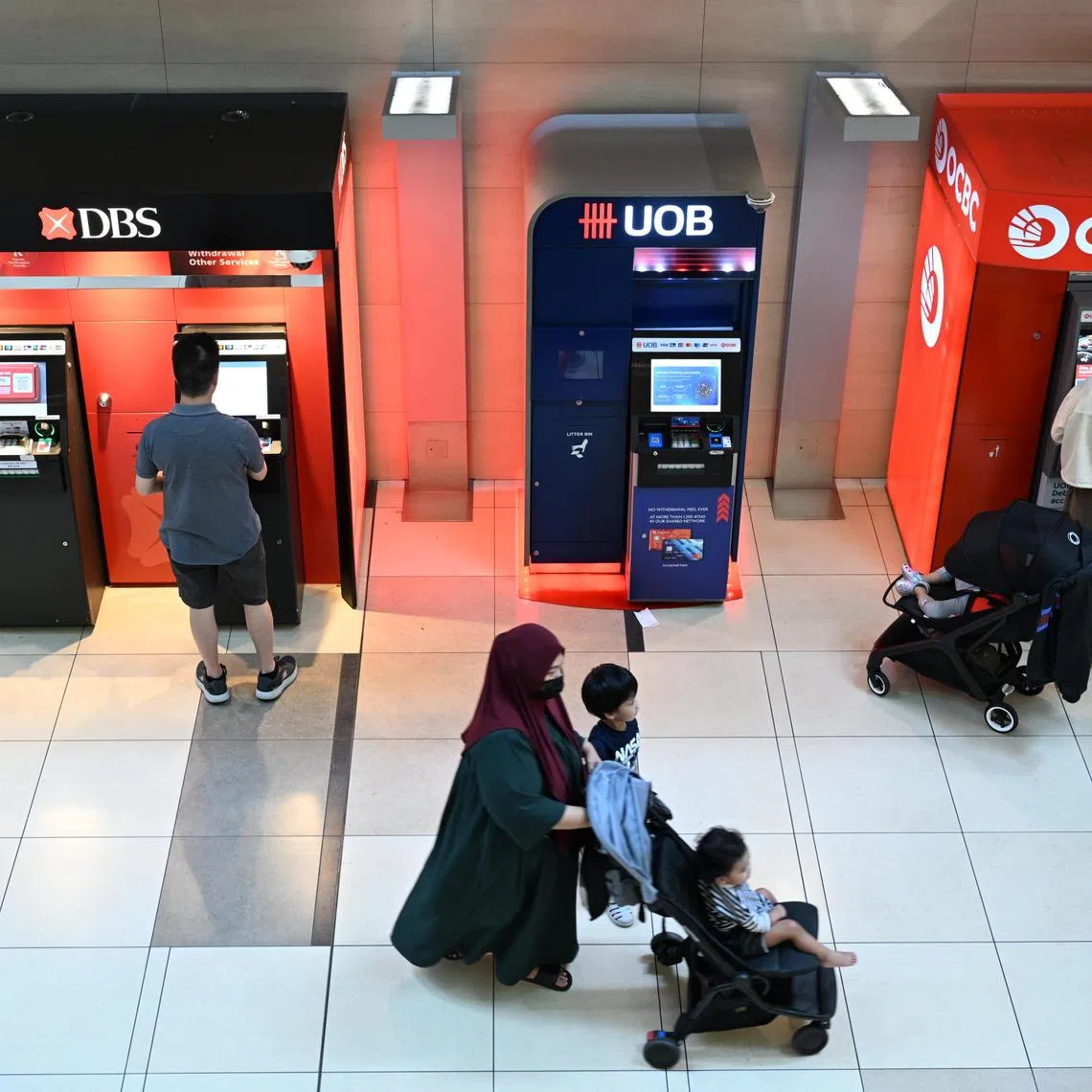 Generic photo of DBS , UOB , OCBC atm taken at changi airport terminal 3 on July 3, 2024. 

Can be used for money, finance, bank , banking stories