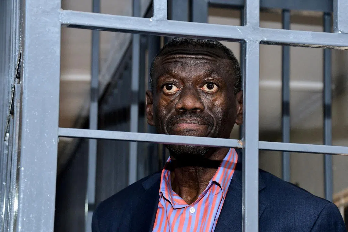 FILE PHOTO: Ugandan four-time presidential aspirant Kizza Besigye stands in the steel dock at the Uganda Military General Court Martial that sits in Makindye suburb of Kampala, Uganda November 20, 2024. REUTERS/Abubaker Lubowa/File Photo