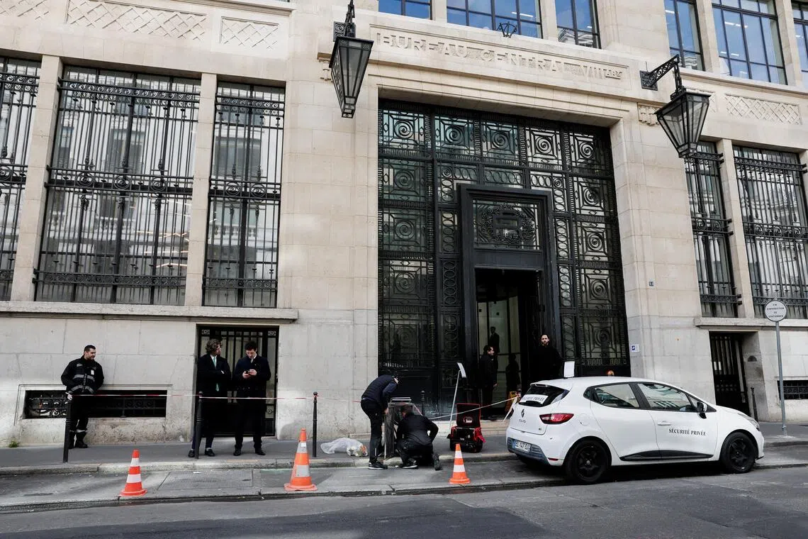 Private security members gather outside Bank of America’s Paris offices, after French anti-terrorism prosecutors opened an investigation into attempted destruction by fire or other dangerous means in Paris, France, March 30, 2026. REUTERS/Benoit Tessier