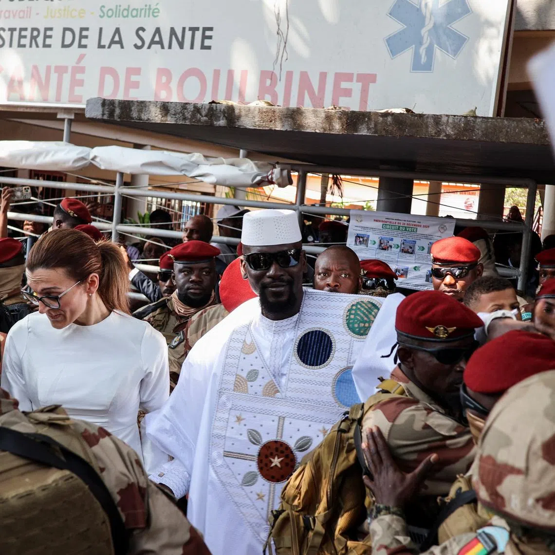 Guinean leader Mamadi Doumbouya arrives with his wife, Lauriane Darboux Doumbouya, to cast his vote during the presidential election at a polling station in Conakry, Guinea, December 28, 2025. REUTERS/ Souleymane Camar