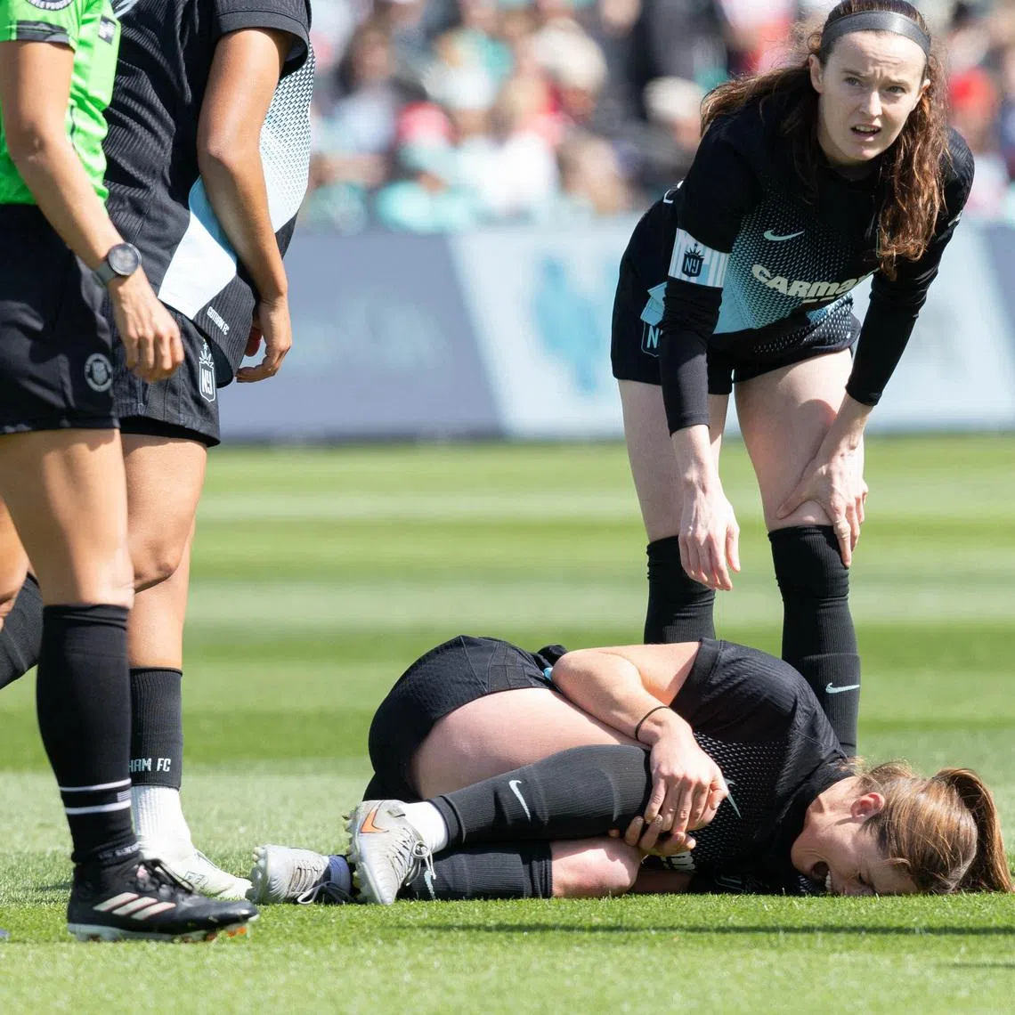 Apr 4, 2026; Kansas City, Missouri, USA; Gotham FC defender Kayla Duran (19) reacts to an apparent injury during the game against the Kansas City Current at CPKC Stadium. Mandatory Credit: Kylie Graham-Imagn Images