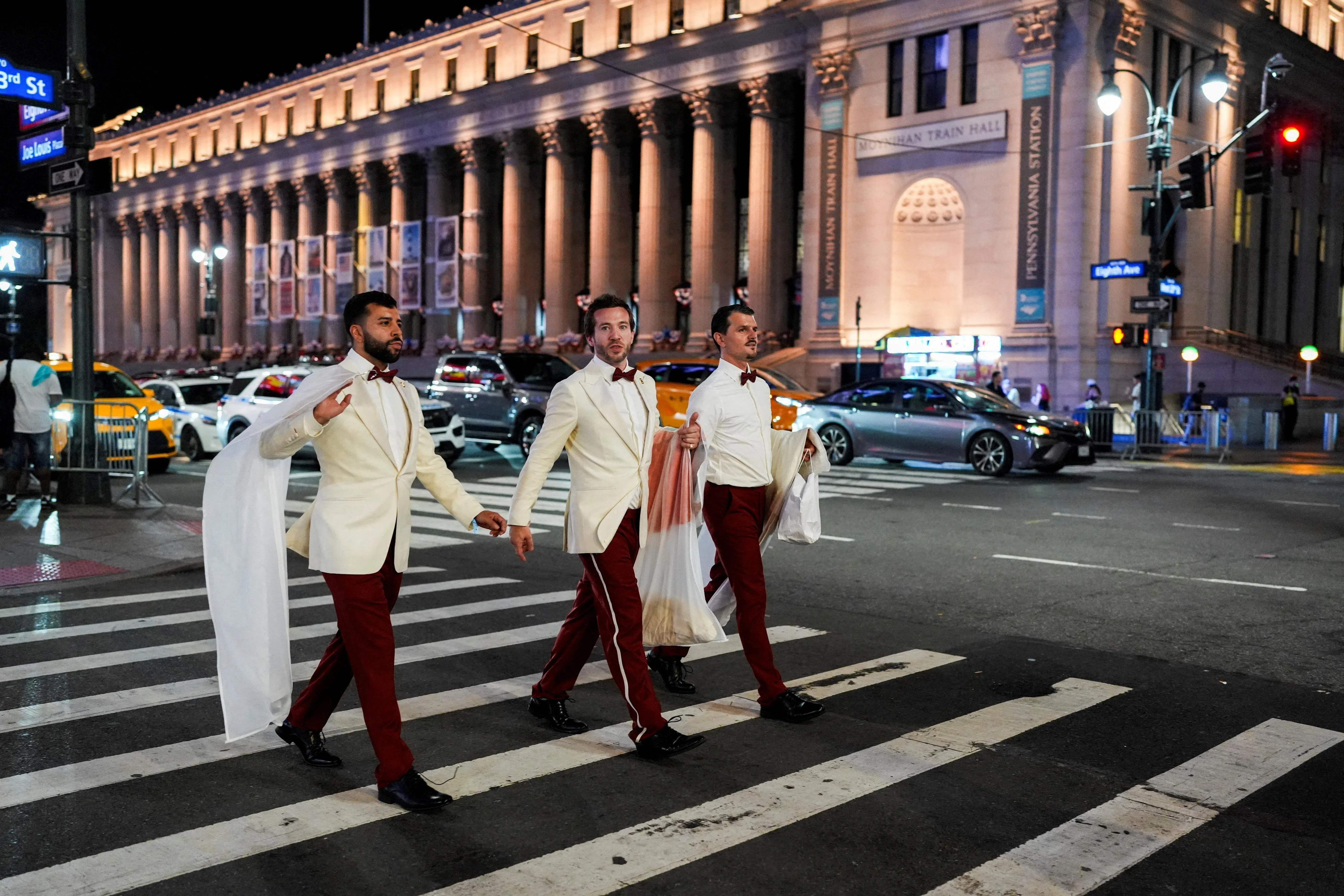 Workers believed to be a part of the reported wedding between singer Taylor Swift and National Football League (NFL) player Travis Kelce, cross a road outside Madison Square Garden, in New York City, U.S., July 3, 2026. REUTERS/Christian Monterrosa     TPX IMAGES OF THE DAY