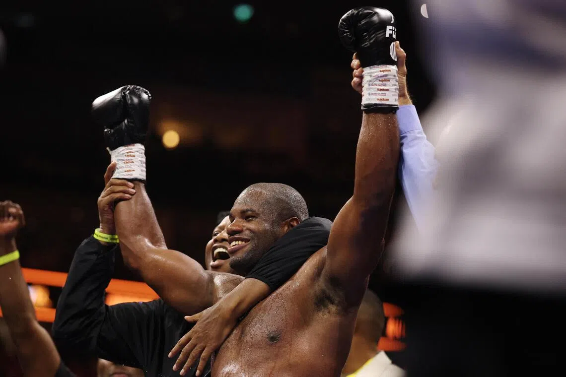 Daniel Dubois celebrates after winning his WBO world heavyweight title fight against Fabio Wardley at the O2 Arena in London on Oct 17.