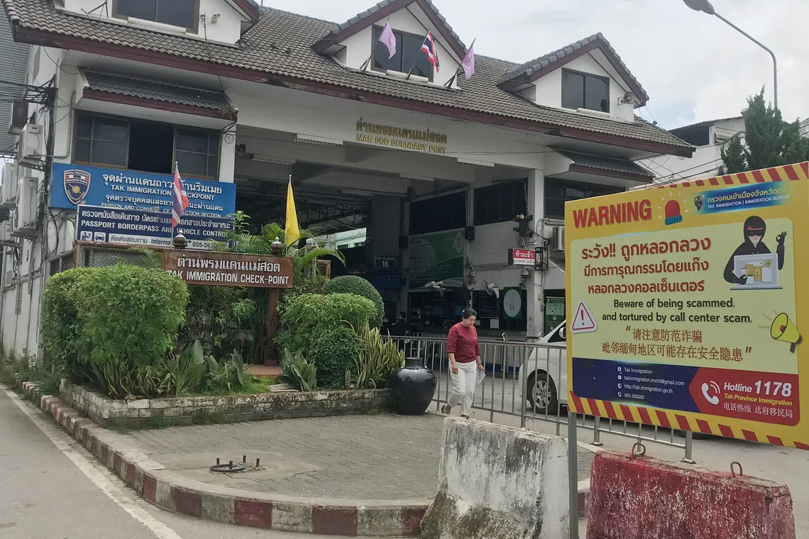 A scam awareness poster at the immigration checkpoint between Thailand and Myanmar in the Thai border town of Mae Sot.