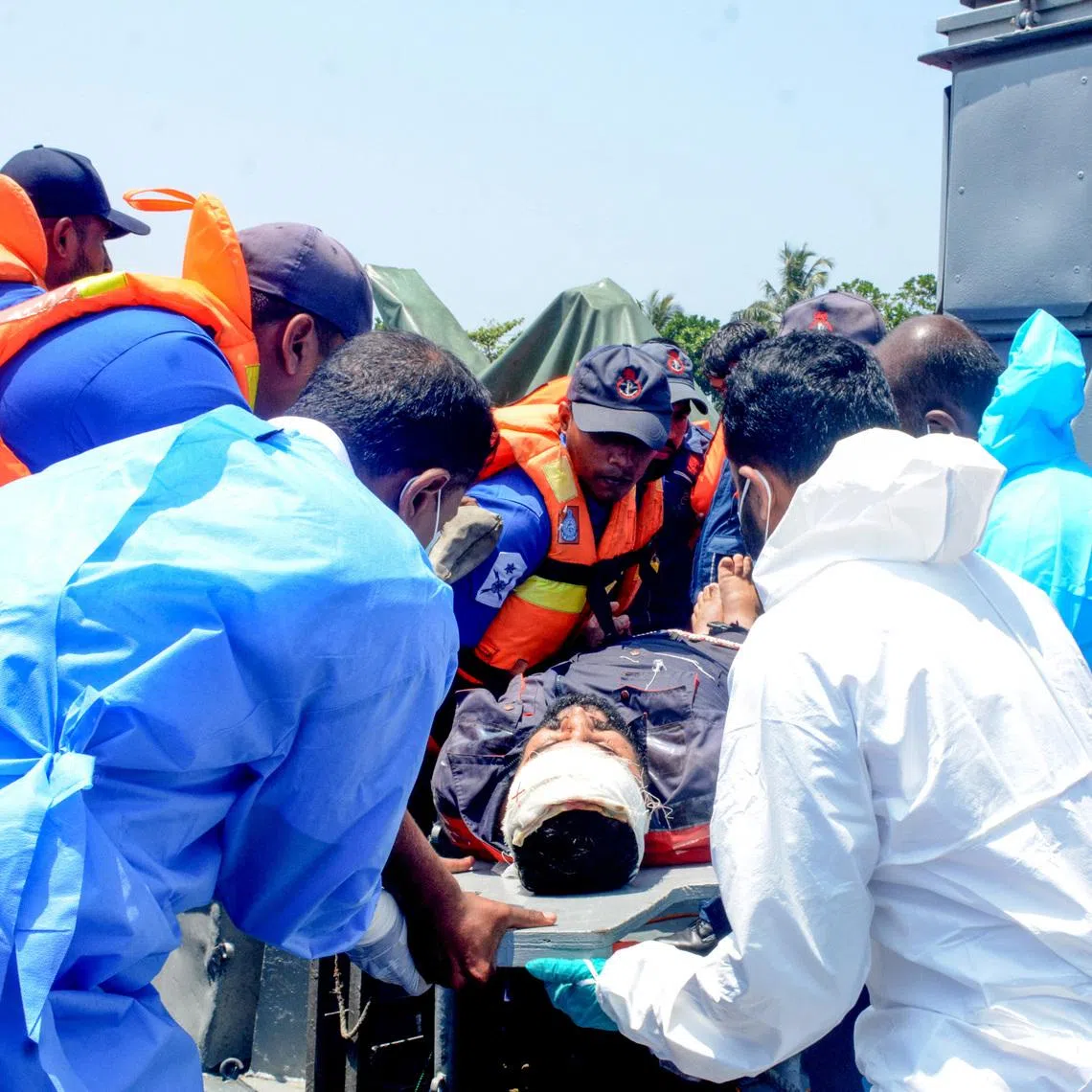 Medical personnel and Sri Lanka Navy sailors provide emergency treatment to an injured Iranian crew member rescued after responding to a distress call from the Iranian military ship, IRIS Dena, while at sea within Sri Lanka’s maritime search and rescue region, in Indian Ocean, Sri Lanka, March 4, 2026. Sri Lanka Navy/Handout via REUTERS