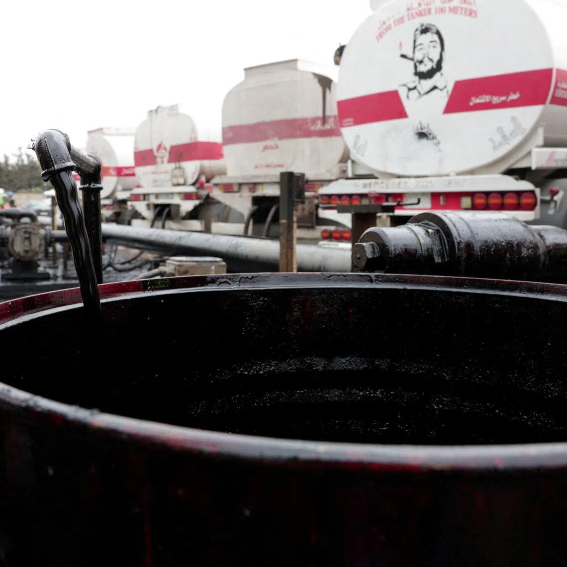 A barrel being filled with oil delivered from Iraq at the oil terminal of Baniyas, Syria in May 2026. Iraq is one of the Opec+ members seeking a higher quota and has considered leaving the group.