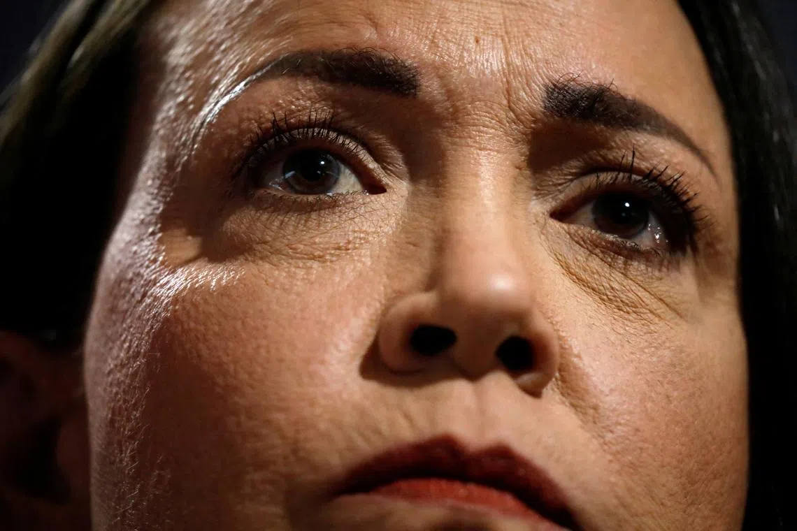FILE PHOTO: Venezuelan opposition leader Maria Corina Machado looks on while addressing the media, in Caracas, Venezuela, March 20, 2024. REUTERS/Leonardo Fernandez Viloria/File Photo