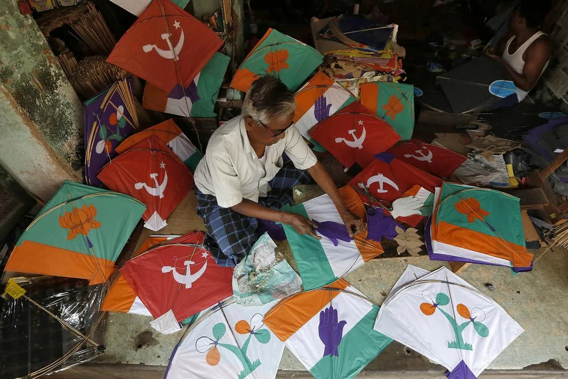 A kite-maker prepares kites with election symbols of Indian political parties at his shop ahead of India's general election, in Kolkata, India, March 27, 2019. REUTERS/Rupak De Chowdhuri/File Photo