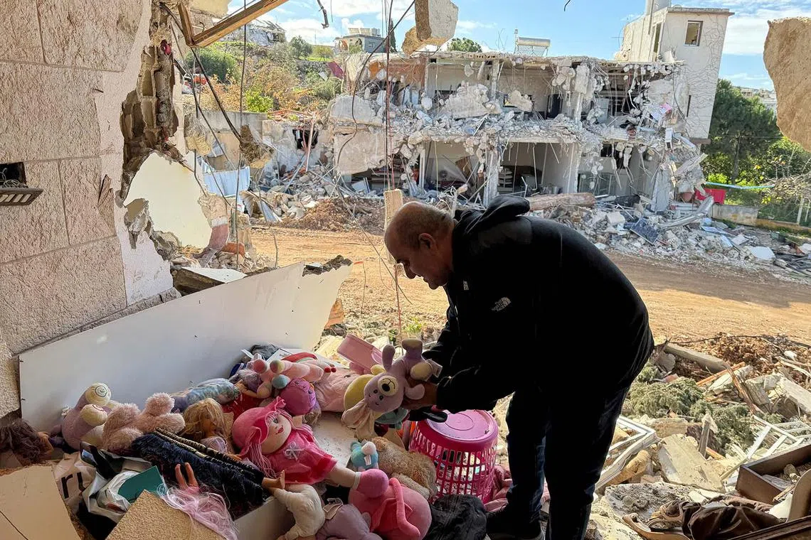 Resident of Naqoura Mohammed Hamda al-Nawra, who was previously displaced because of the hostilities between Hezbollah and Israel, inspects his damaged house as he returns back, in Naqoura, near the border with Israel, southern Lebanon, January 23, 2025. REUTERS/Ali Hankir TPX IMAGES OF THE DAY