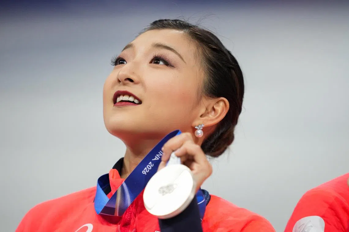 Feb 8, 2026; Milan, Italy; Kaori Sakamoto of Japan celebrates winning silver in the team figure skating event during the Milano Cortina 2026 Olympic Winter Games at Milano Ice Skating Arena. Mandatory Credit: James Lang-Imagn Images