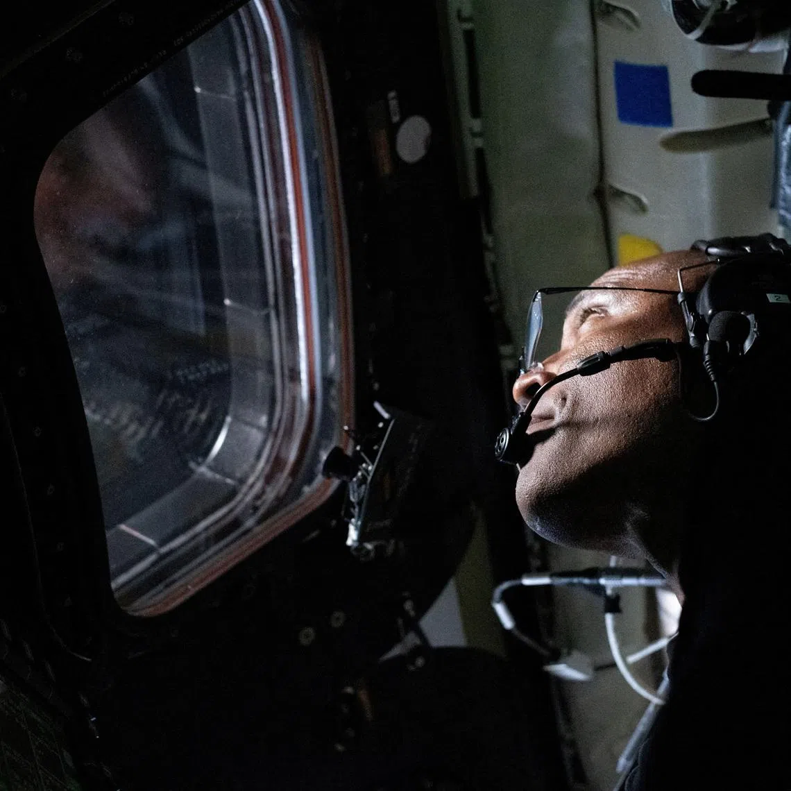 FILE PHOTO: NASA astronaut and Artemis II Pilot Victor Glover is pictured here in the Orion spacecraft during the Artemis II lunar flyby April 6, 2026. NASA/Handout via REUTERS