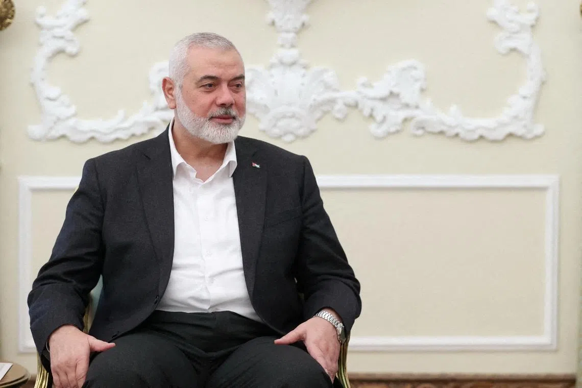 Palestinian group Hamas' top leader, Ismail Haniyeh meets with Iranian President Ebrahim Raisi (not pictured) in Tehran, Iran March 27, 2024. Iran's Presidency/WANA (West Asia News Agency)/Handout via REUTERS/File Photo